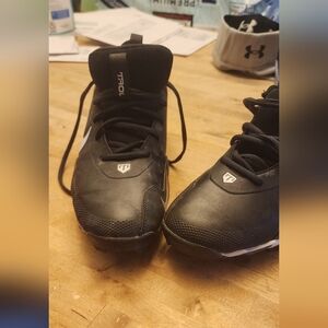 Black Nike Cleats with White Swoosh